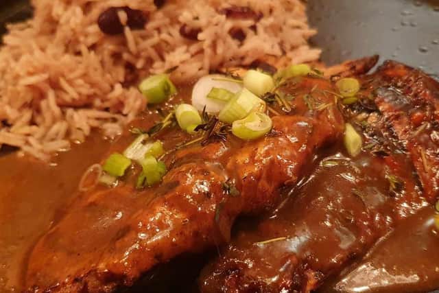 Succulent marinated & chargrilled chicken breast topped with our rich jerk gravy. Served with slaw & either coconut rice & peas or spiced fries.