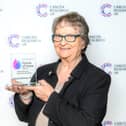 Sue Shuttleworth and her award.