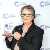 Sue Shuttleworth and her award.