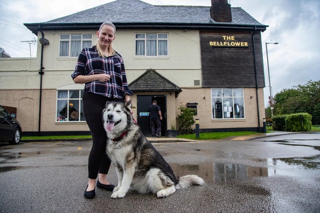 Heather Porter-Brandwood, 35, general manager, with her dog Maia, 10, an Alaskan Malamute.