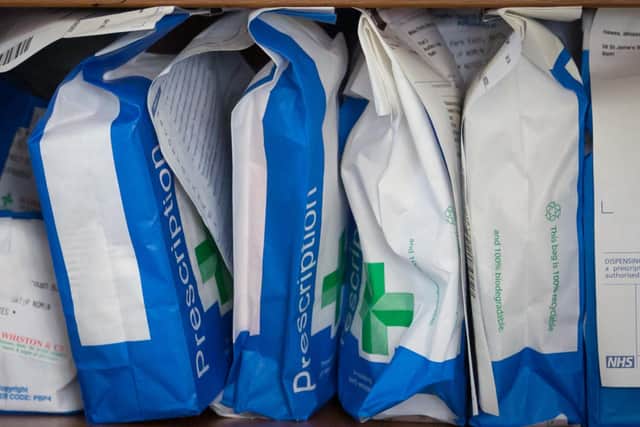Pharmaceuticals and prescriptions awaiting collection are seen inside a independent chemist shop. Photo by Matt Cardy/Getty Images