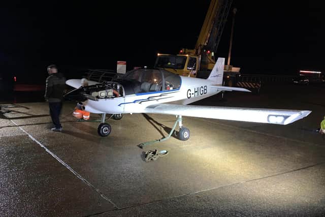 Rescue crews recovering the plane after it was forced to make an emergency landing on the beach in South Shore last night (Thursday, November 16). (Picture by Tatiana Dunderdale)