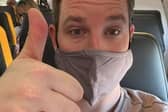 Max Fox on a plane to Poland, on his way to help with humanitarian efforts. (Credit: PA)