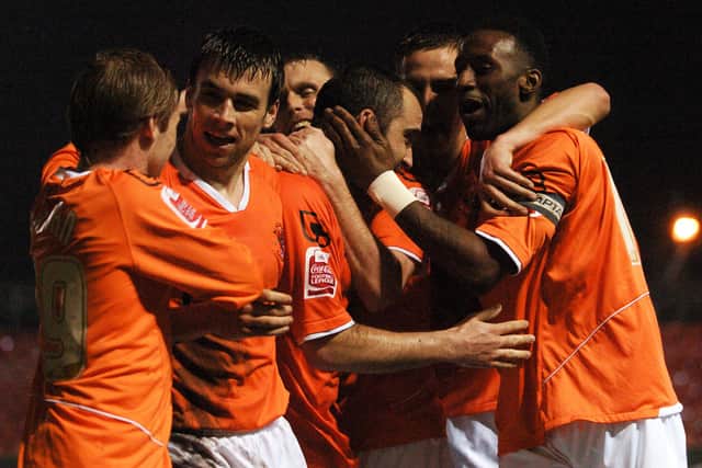 Gary Taylor-Fletcher is mobbed after scoring Blackpool's fifth goal against Swansea