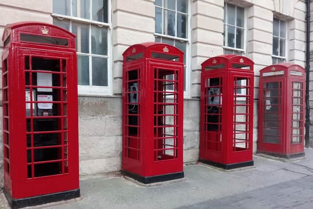 Red phone boxes outside the old post office in Abingdon Street, Blackpool town centre.