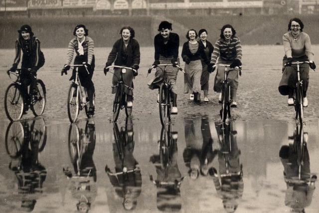 Co-op girls on Blackpool beach on their bikes during their lunchbreak in the mid 1930s