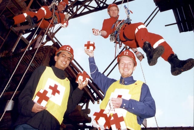 Lancashire Fire and Rescue Service 2000 Visual Aids Dept at Blackpool Tower. In the picture are Fire Fighter Tony Murray and Leading Fire Fighter Adam Cooper with British Red Cross Volunteer Sukhdip Jhaj and British Red Cross Fundraiser David Bollenberg