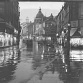 Church Street close to the junction of Bank Hey Street, with the familiar site of The Grand Theatre ( in the centre) and H Samuels (on the right)