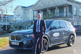 Ribby Hall Director of HR, Estate Maintenance and Safety, John McIlwham with new BMW iX1. Photo:  Bowker BMW