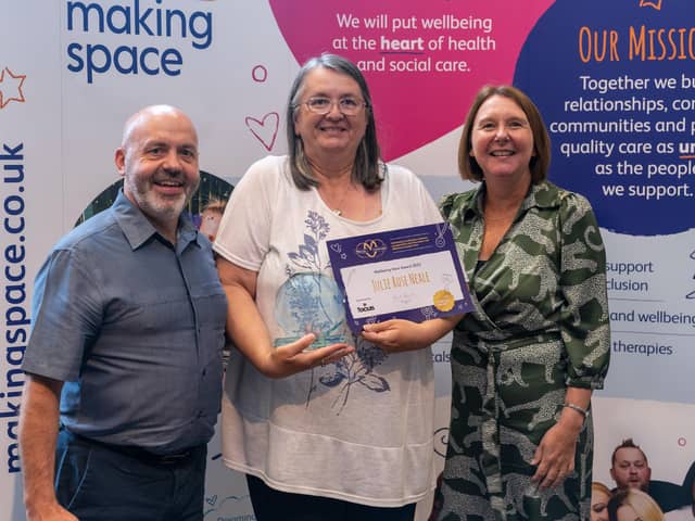 Julie Rose Neale collecting her award from charity Making Space.