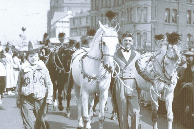 The clown Doodles in a circus parade, in 1930, passing the Palatine Hotel, in Blackpool