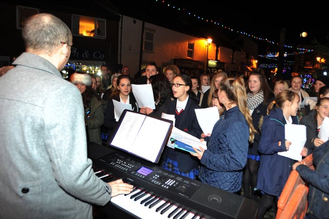 Students from Garstang Academy form a choir and band and perform at the Garstang Christmas lights switch-on event in 2014