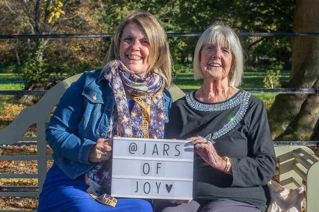 Karen Nicholson (right) with her own jar of joy and mum Margaret Curphey