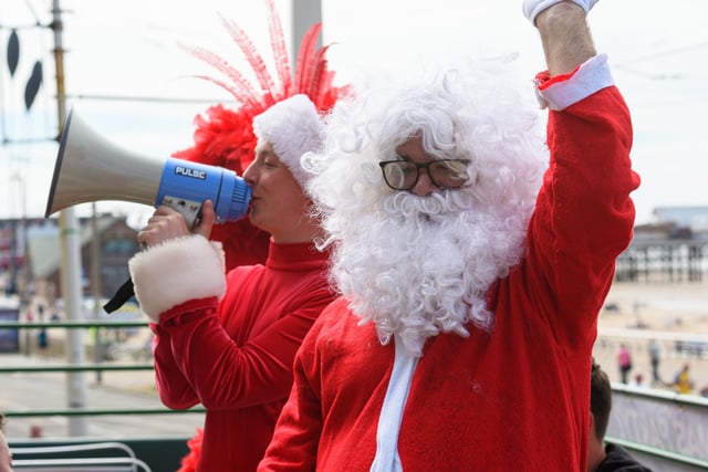 Santa Claus waves to the crowds along the seafront. Photo: Kelvin Stuttard