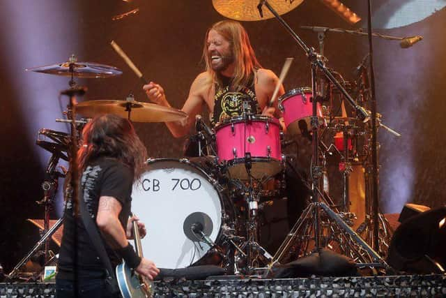 Taylor Hawkins performs at the Innings Festival at Tempe Beach Park in Tempe, Arizona.
Credit: AP