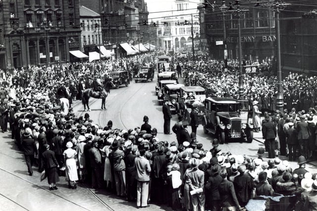 The crowds turn out in Sheffield to see King George VI and the Queen Mother