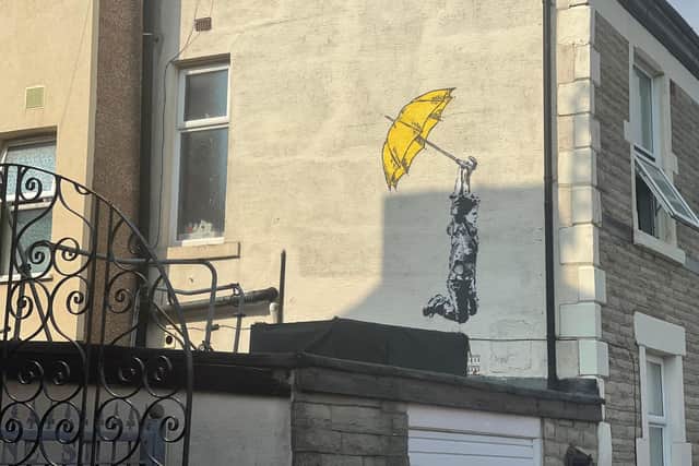 The mural in the style of anonymous street artist Banksy was discovered in Milbourne Street, Blackpool on Thursday morning (July 21). Pic credit: Sam Dooley