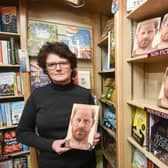 Spare, an autobiography by Prince Harry, on sale at Book, Bean and Ice Cream in Kirkham. Pictured is owner Elaine Silverwood.