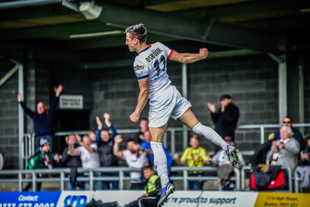 High-flying celebrations for Fylde's two-goal Sam Osborne at Boston Picture: STEVE MCLELLAN