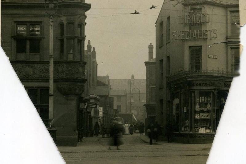 Talbot Square looking down The Strand towards Queen Street and the Princess Picture House. Smokers Tobacco Specialists to the right. It's dated 1930s or 1940s