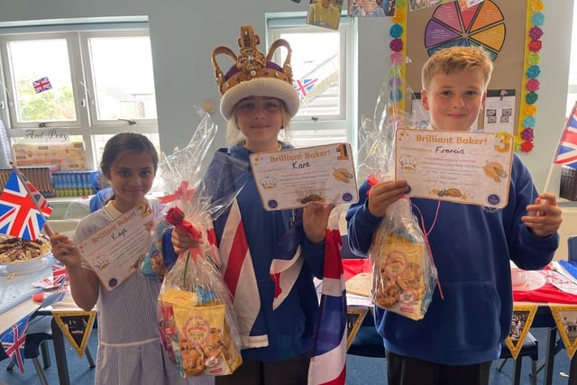 Kaya, Karla and Thomas with some of their cakes as part of the Queen's jubilee celebrations at St Mary's Catholic School in Fleetwood
