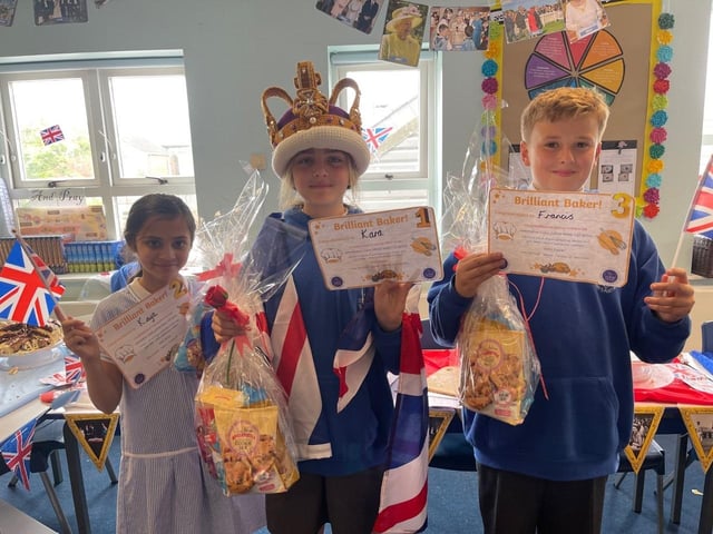 Kaya, Karla and Thomas with some of their cakes as part of the Queen's jubilee celebrations at St Mary's Catholic School in Fleetwood