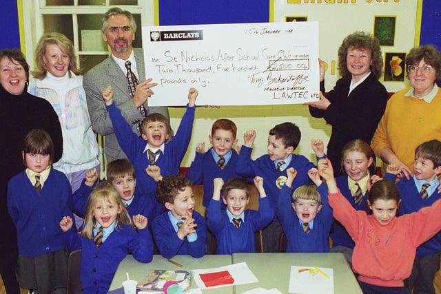 The After School Care Club at St. Nicholas CE Primary School received a cheque for £2,500 from LAWTEC
