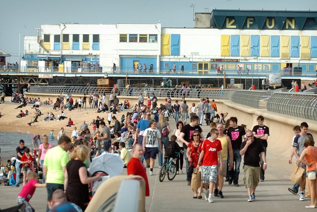 The first hot weather of the year brought crowds flocking into Blackpool in 2011. Central Pier in the background