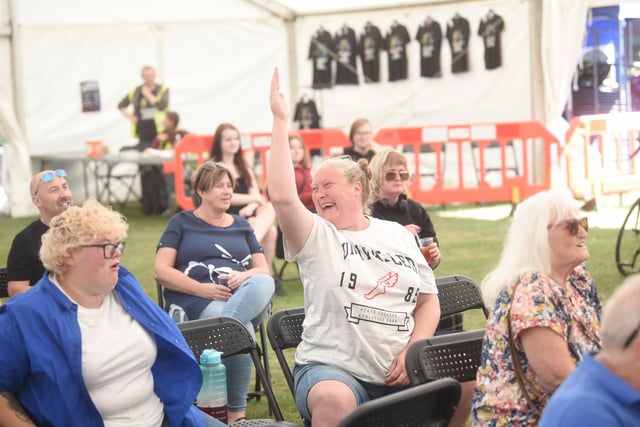 Put your hands in the air - crowds enjoying themselves at St Annes Music Festival