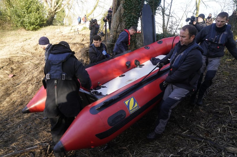 Workers from a private underwater search and recovery company, Specialist Group International, move a rigid inflatable boat (rib) into the river in St Michael's on Wyre as they launch a fresh sweet of the River Wyre in search for missing woman Nicola Bulley. Picture by Danny Lawson/PA