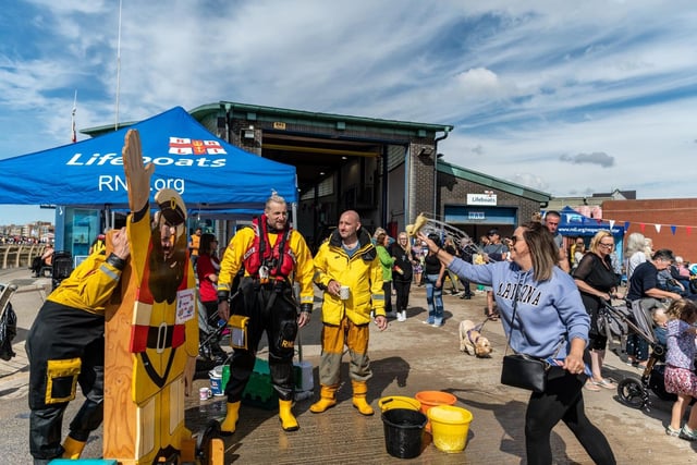 Sponge throwing at a crew member was just one of the fun attractions at the event. Picture: Alan Hunter.