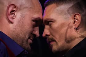 Britain's Tyson Fury (L) and Ukraine's Oleksandr Usyk (R) face off during a press conference.