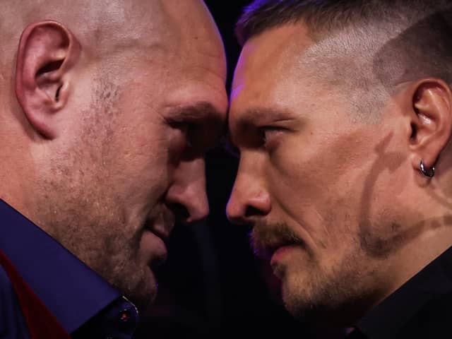 Britain's Tyson Fury (L) and Ukraine's Oleksandr Usyk (R) face off during a press conference.