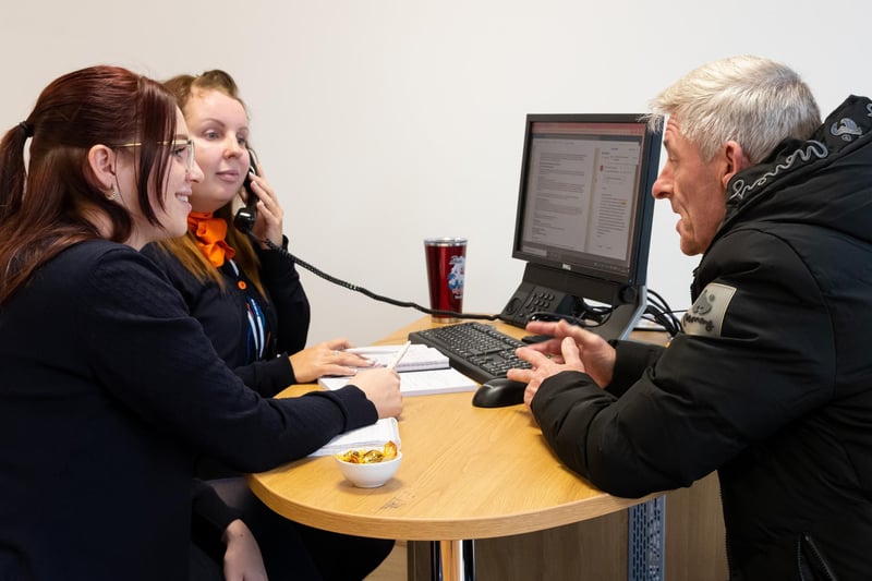 Staff deal with a customer on a busy opening day at Hays Travel's new office in Cleveleys. Photo: Kelvin Stuttard