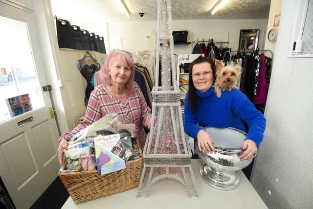 Chrissie Meryem and Hanna Statham with dog Cookie are auctioning items including a replica tower to raise money for animals in Ukraine.