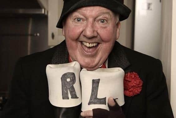 Jimmy Cricket with his trademark left- and right-labelled wellington boots, which he'd wear on the wrong feet.