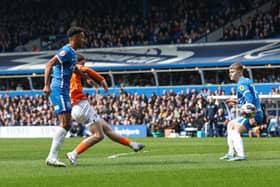 Josh Bowler gets a shot off at goal during Blackpool's vital win