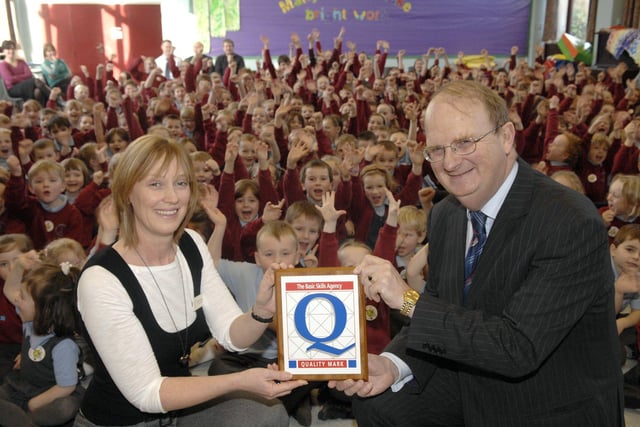 Gill Finney of Baines Endowed School, Thornton accepts the Basic Skills Quality Award from Dr Graham Dunn in 2009