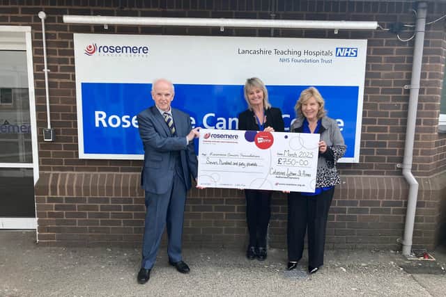 Dr Murphy and his wife Yvonne (right) present Rosemere Cancer Foundation’s Sue Swire with the donation from members of Lytham St Anne’s Catenian Association