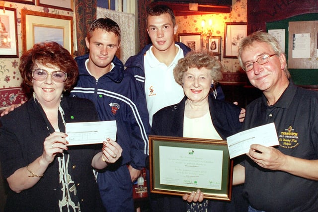 Wheatsheaf licensee Barrie Eastwood hands over a cheque for £1,000 to representatives of the NSPCC. From left, Judith Hayes (NSPCC Lanc's Area Appeals Manager), Blackpool FC players Phil Robinson and Andy Barnes, June Duerden (chairman of Blackpool, Fylde and West Wyre NSPCC branch) and Barrie Eastwood. This was in 1999