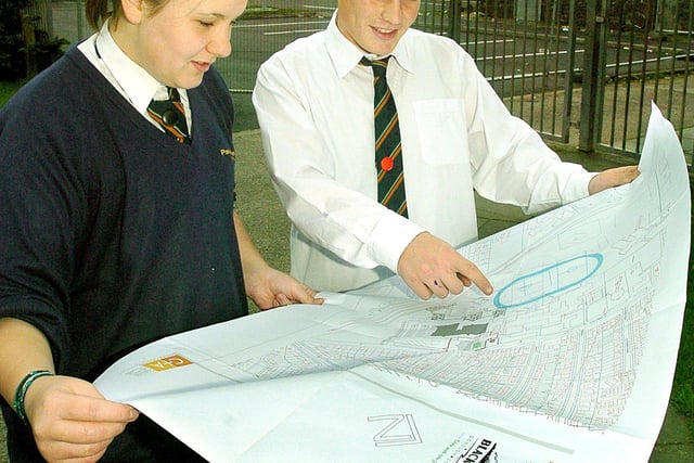 Year ten pupils Matthew Hardman and Sophie Bryce looking at the plans for the new leisure centre in 2004