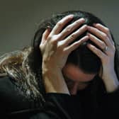 PICTURE POSED BY A MODEL. 

File photo dated 08/11/07 of a woman holding her head in her hands. The number of young people admitted to adult mental health wards has increased since last year, a new report has shown. Eighty young people were admitted to primarily adult wards for mental health treatment in 2021-22, up from 62 in 2020-21. Issue date: Thursday December 1, 2022. PA Photo. See PA story SCOTLAND MentalHealth. Photo credit should read: David Cheskin/PA Wire