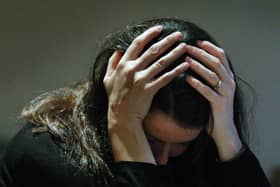 PICTURE POSED BY A MODEL. 

File photo dated 08/11/07 of a woman holding her head in her hands. The number of young people admitted to adult mental health wards has increased since last year, a new report has shown. Eighty young people were admitted to primarily adult wards for mental health treatment in 2021-22, up from 62 in 2020-21. Issue date: Thursday December 1, 2022. PA Photo. See PA story SCOTLAND MentalHealth. Photo credit should read: David Cheskin/PA Wire
