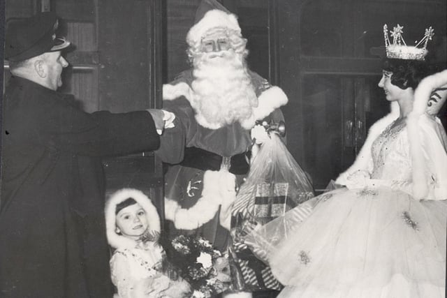 Welcome to Blackpool... the station master at North Station Mr T Davidson welcomes Father Christmas on his arrival by train on his way to R.H.O Hills at Blackpool 1963 with the Fairy Queen