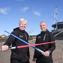 Light sabers at the ready!  Craig McOmish and Paul Haslam outside the former Cafe Cove on Cleveleys beach front, which features  in an episode of Star Wars Andor. The pair are opening a new coffee house there next month.