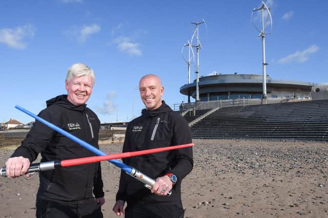 Light sabers at the ready! Craig McOmish and Paul Haslam outside the former Cafe Cove on Cleveleys beach front, which features in an episode of Star Wars Andor. The pair are opening a new coffee house there next month.