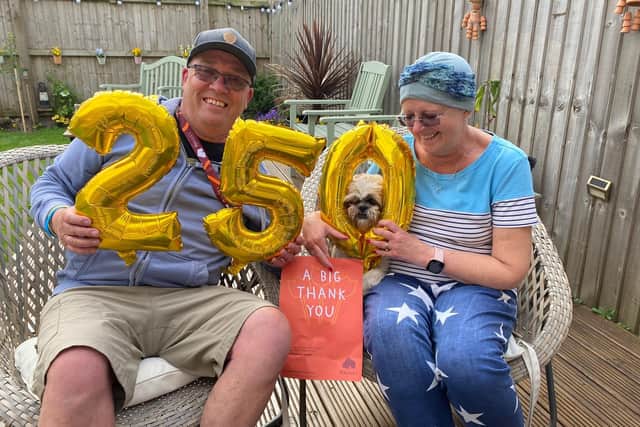 Peter Naylor completed a cycle challenge with support from wife Barbara and dog Bella