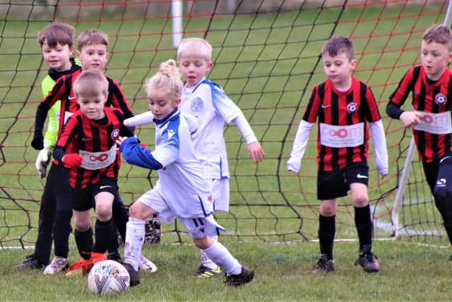 Match of the week action between the under-sevens of Poulton FC Reds and BJFF Blades  Pictures: BLACKPOOL AND DISTRICT YOUTH LEAGUE