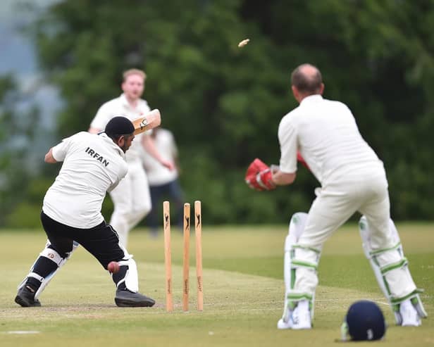 The bails fly in a dramatic moment from a previous Blackburn Diocese cricket match.