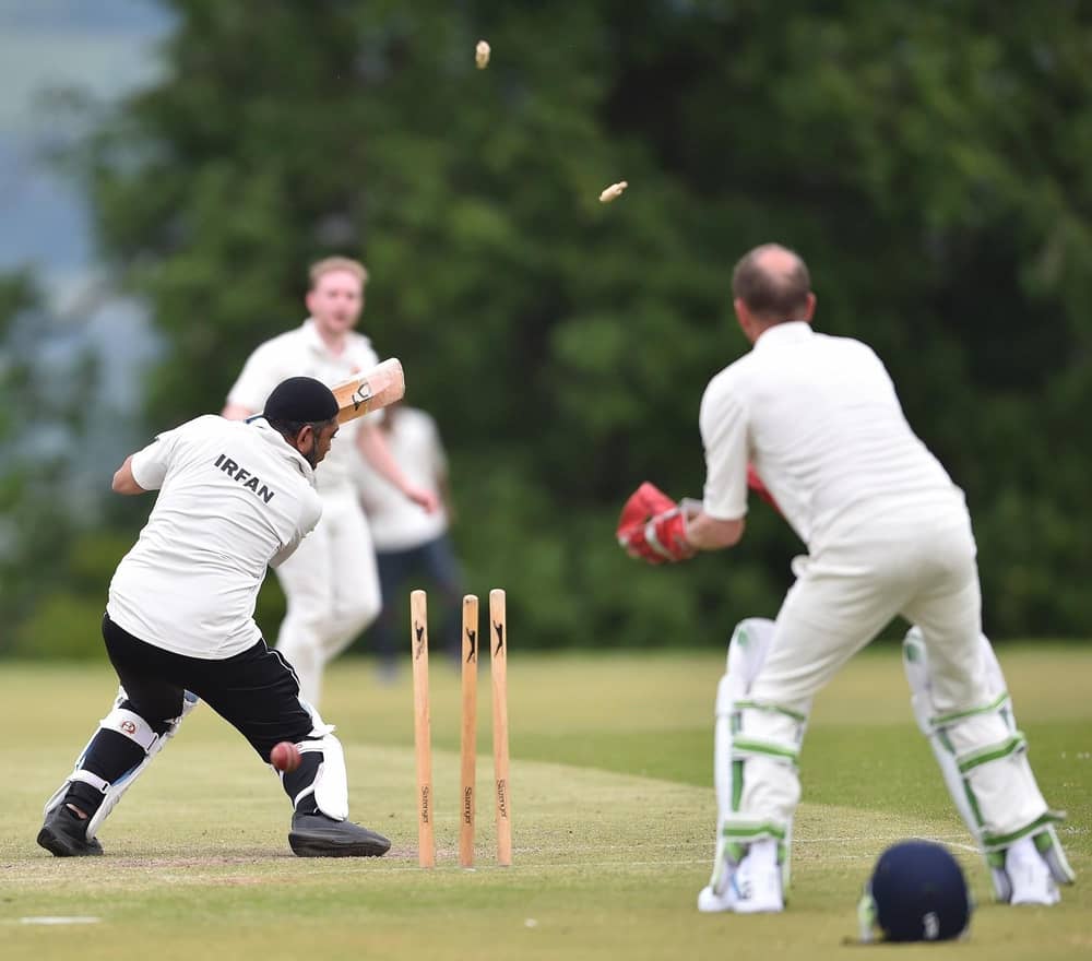 The bails fly in a dramatic moment from a previous Blackburn Diocese cricket match.